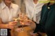 A group of women toasting with wine glasses at a table.